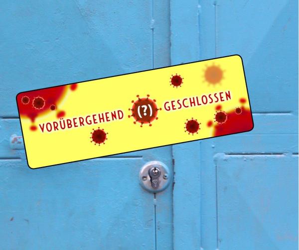 Holztür mit Schild mit Corona-Viren und der Beschriftung Vorübergehend? Geschlossen